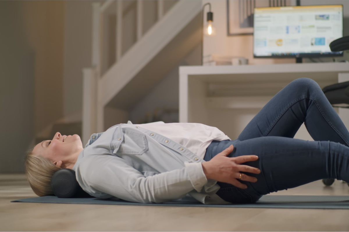 woman relaxing with head supported by Neck Stretcher